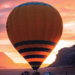 Hot air balloon in Wadi Rum at sunrise